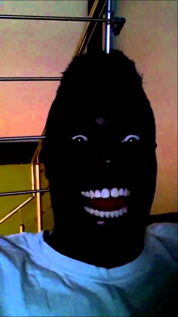image of Black Man Laughing in the Dark